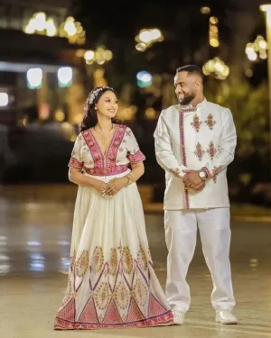Unified Grace in Pink and Golden Habesha Outfit: Vibrant Minimalist Ethiopian Couples Matching Outfit